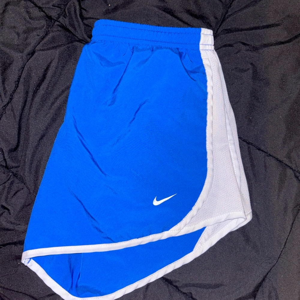 Blue Nike track shorts